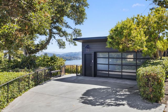 a view of a wooden fence and a tree