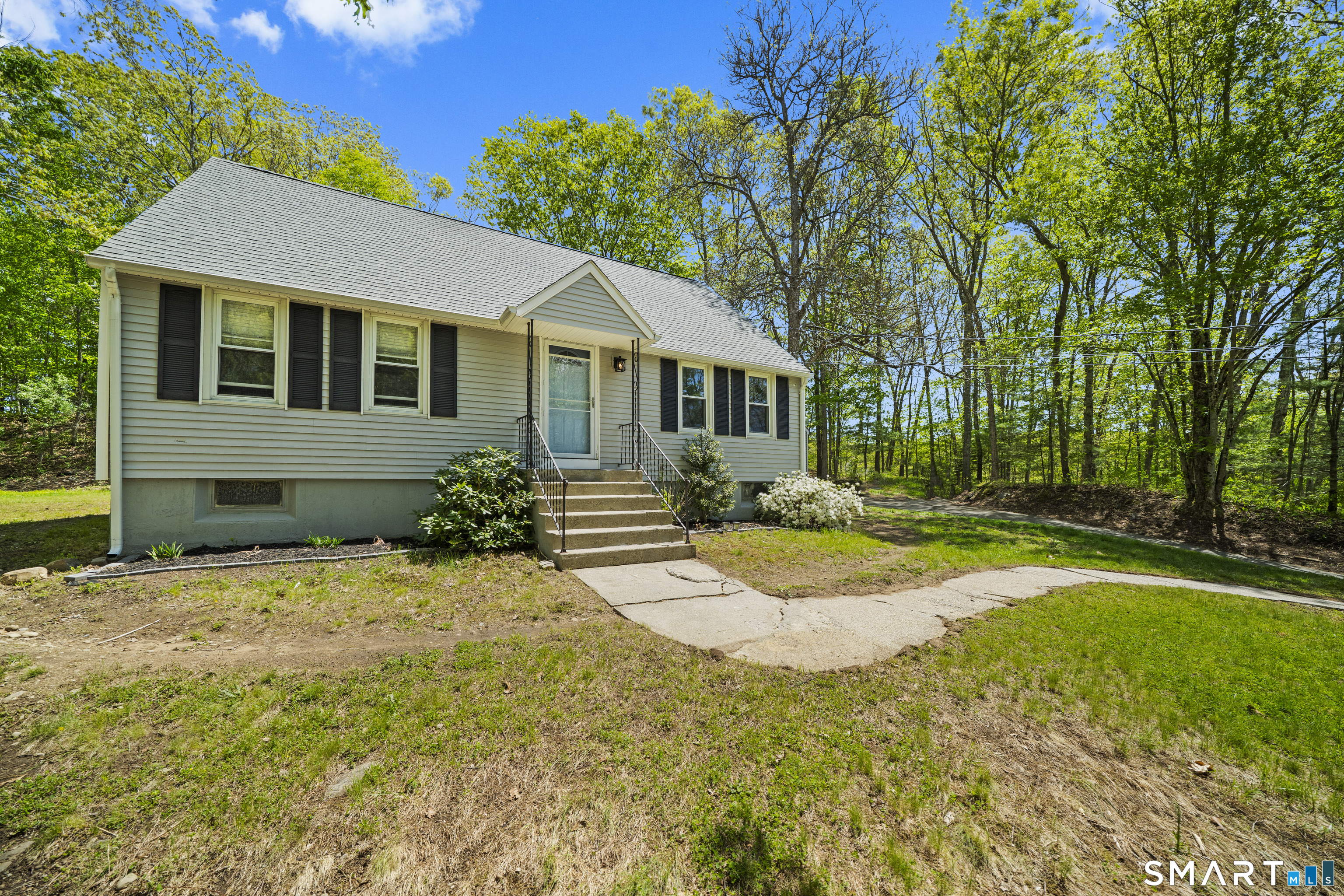 14 Church Street Sprague, CT 06330 - Photo 28 of 36 a front view of a house with a yard