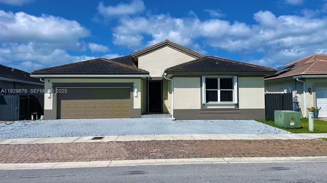 a front view of a house with yard