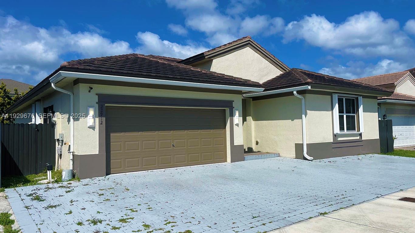 22912 Southwest 115th Court Miami, FL 33170 - Photo 2 of 29 a front view of a house