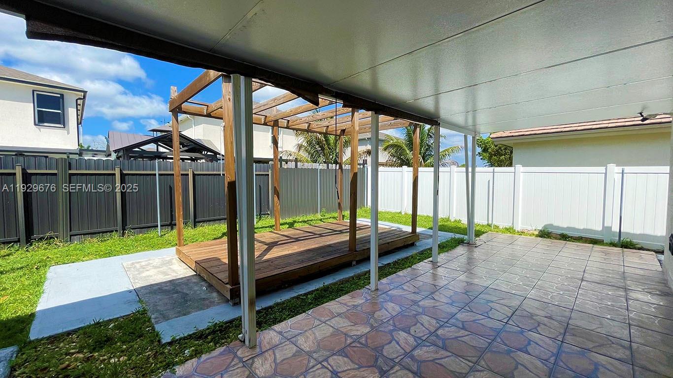 22912 Southwest 115th Court Miami, FL 33170 - Photo 27 of 29 a view of swimming pool with a patio and a yard