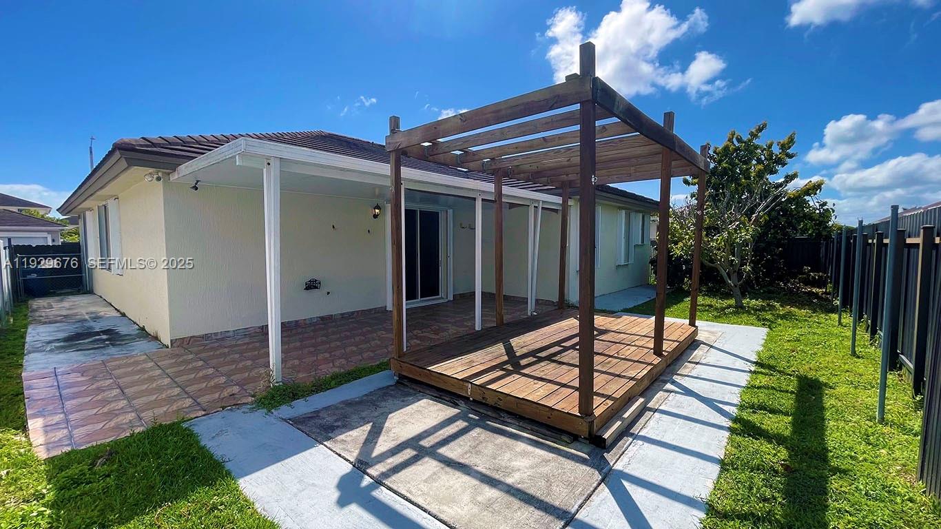 22912 Southwest 115th Court Miami, FL 33170 - Photo 28 of 29 a view of backyard with a patio and outdoor seating