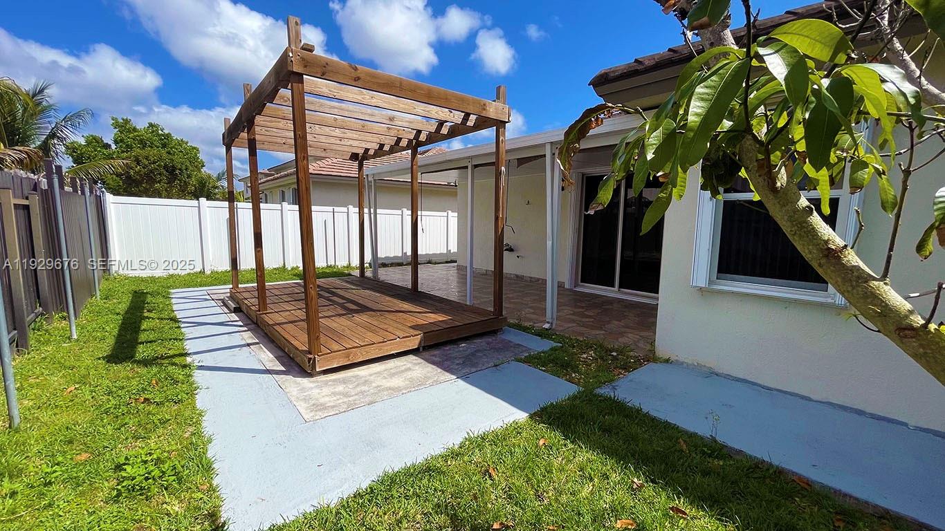 22912 Southwest 115th Court Miami, FL 33170 - Photo 29 of 29 a view of a backyard with a small cabin