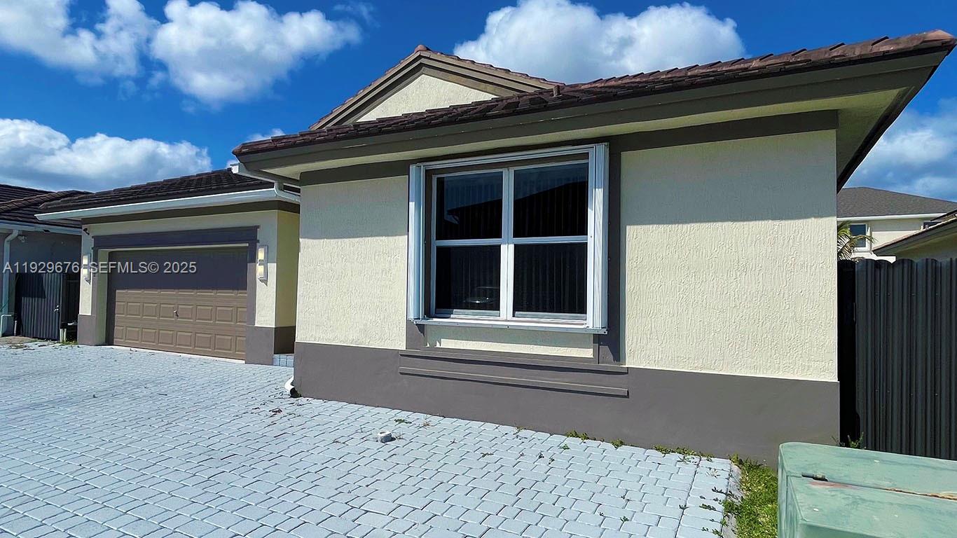 22912 Southwest 115th Court Miami, FL 33170 - Photo 4 of 29 a front view of a house
