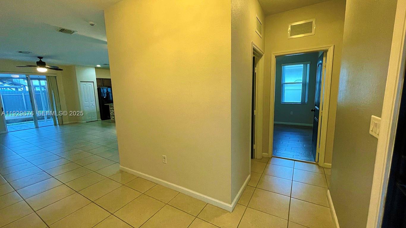 22912 Southwest 115th Court Miami, FL 33170 - Photo 5 of 29 a view of a hallway with wooden floor