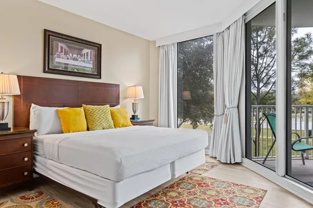 a living room with furniture a dining table and chairs with wooden floor