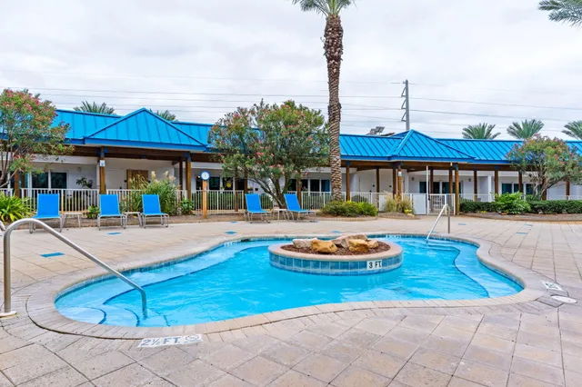 a living room with lots of furniture and a fireplace