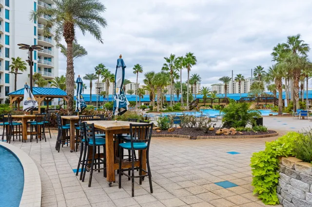 a living room with lots of furniture and a chandelier