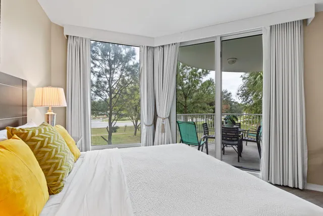 a bathroom with a granite countertop sink mirror vanity and toilet