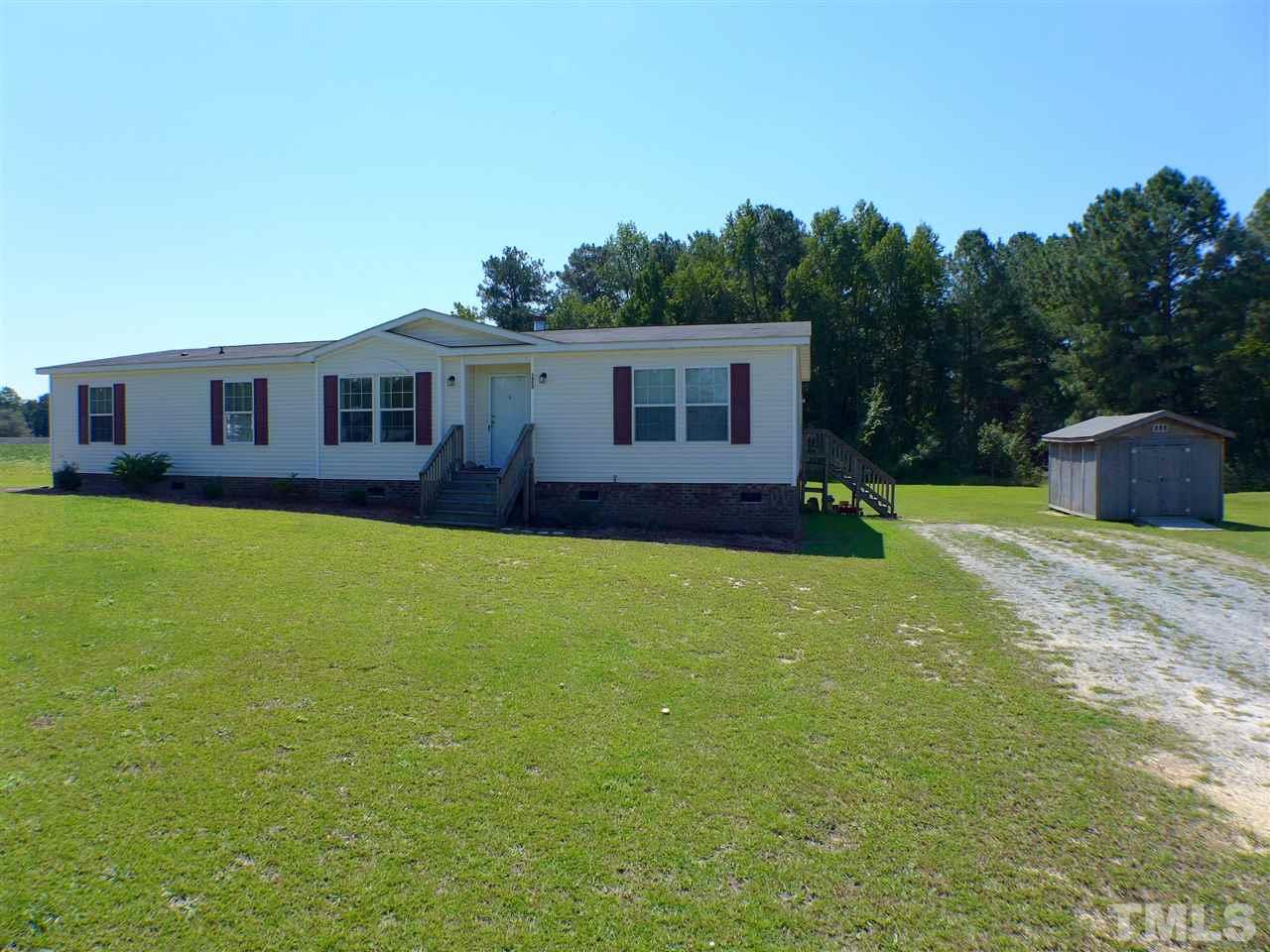 1955 Holly Grove Road Benson, NC 27504 - Photo 1 of 25 a view of a house with a big yard