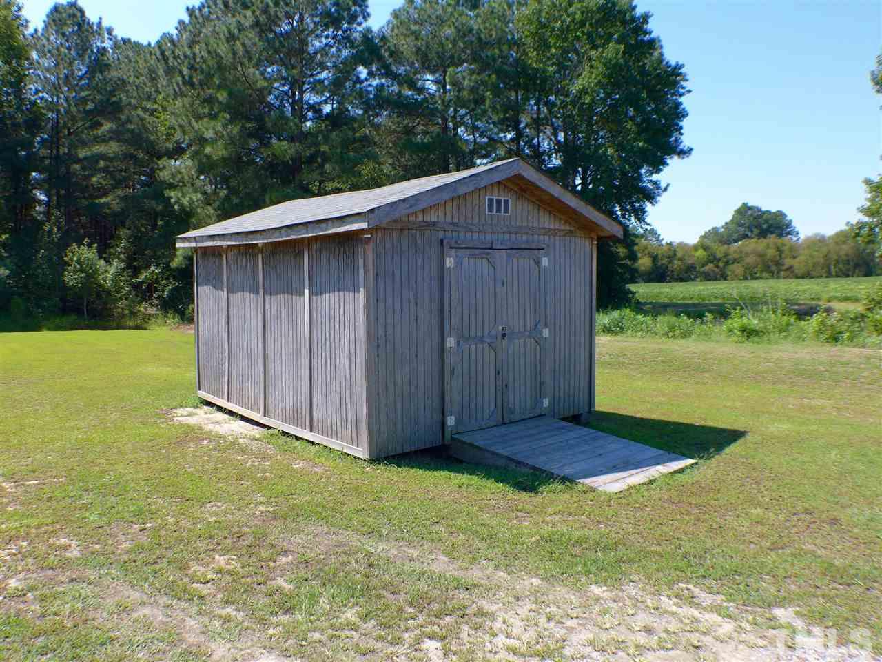 1955 Holly Grove Road Benson, NC 27504 - Photo 24 of 25 a view of backyard with wooden fence