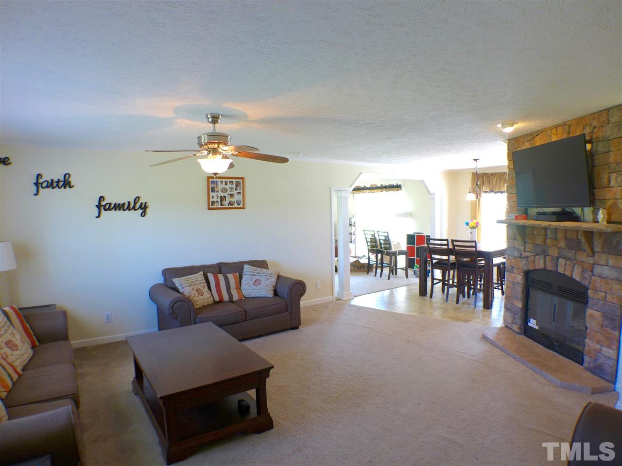 1955 Holly Grove Road Benson, NC 27504 - Photo 4 of 25 a living room with furniture and a fireplace