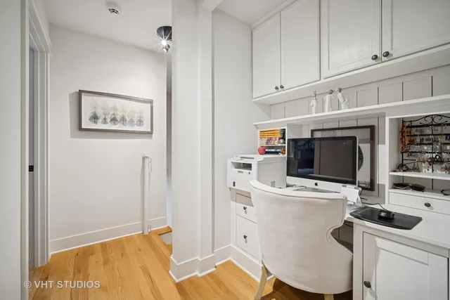 a workspace with furniture and wooden floor