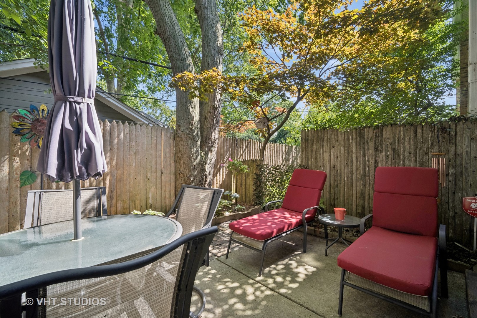 313 Hawthorn Avenue, Unit F Glencoe, IL 60022 - Photo 22 of 27 a backyard of a house with outdoor seating