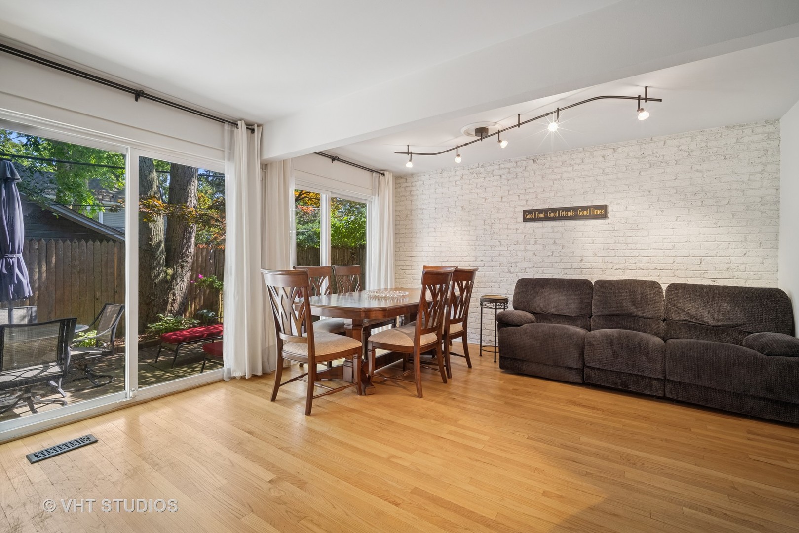313 Hawthorn Avenue, Unit F Glencoe, IL 60022 - Photo 9 of 27 a living room with furniture and a flat screen tv