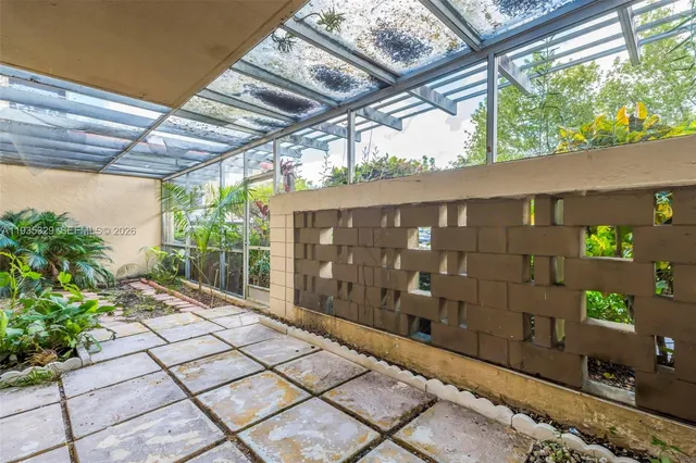 a backyard of a house with outdoor seating and green space