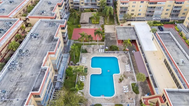 aerial view of multiple houses with yard