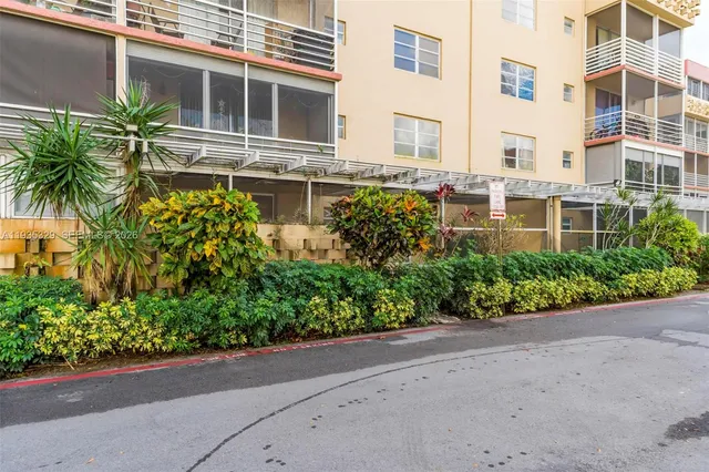 a view of a park with many windows