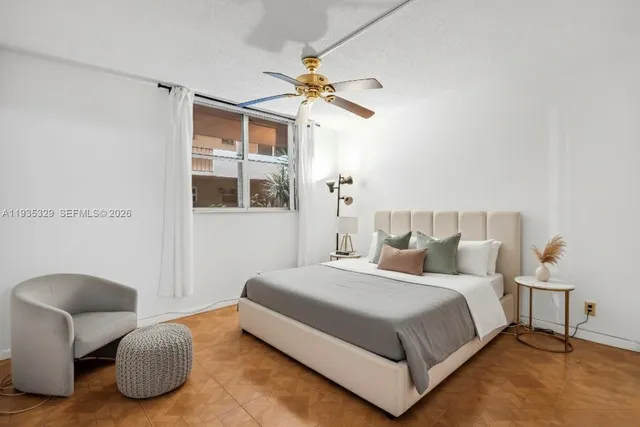 a bedroom with a bed and a chair