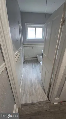 a view of entryway with wooden floor