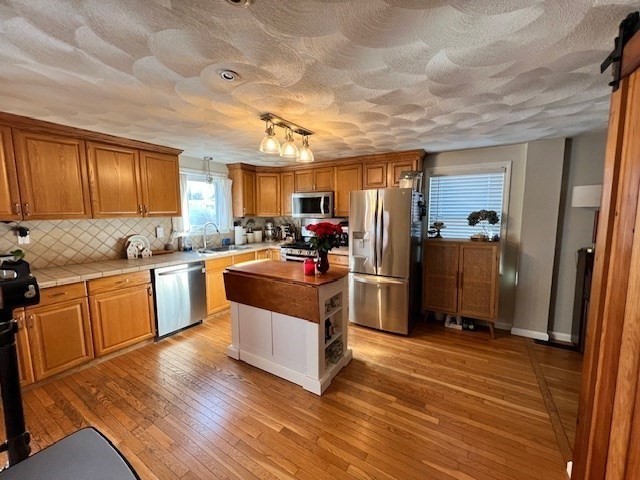 3 Pinecrest Road North Reading, MA 01864 - Photo 19 of 37 a kitchen with granite countertop a refrigerator stove top oven and sink