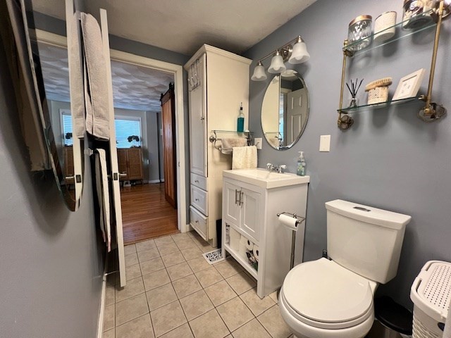 3 Pinecrest Road North Reading, MA 01864 - Photo 25 of 37 a bathroom with a toilet a sink and mirror