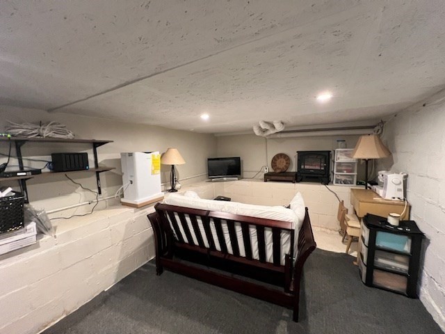 3 Pinecrest Road North Reading, MA 01864 - Photo 34 of 37 a spacious bedroom with a bed a table and chairs