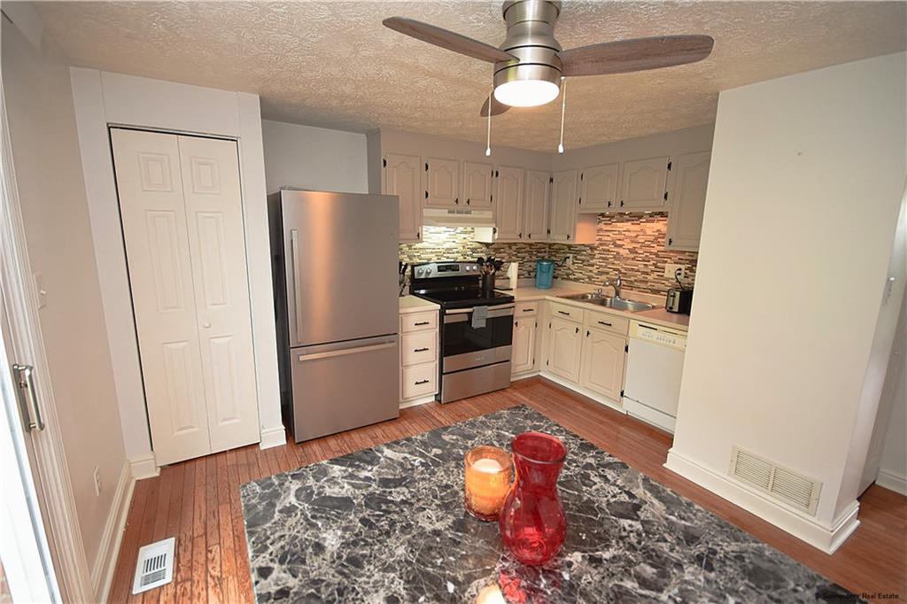 508 Countryside Drive McKees Rocks, PA 15136 - Photo 6 of 25 a kitchen with stainless steel appliances granite countertop a refrigerator a stove and a sink