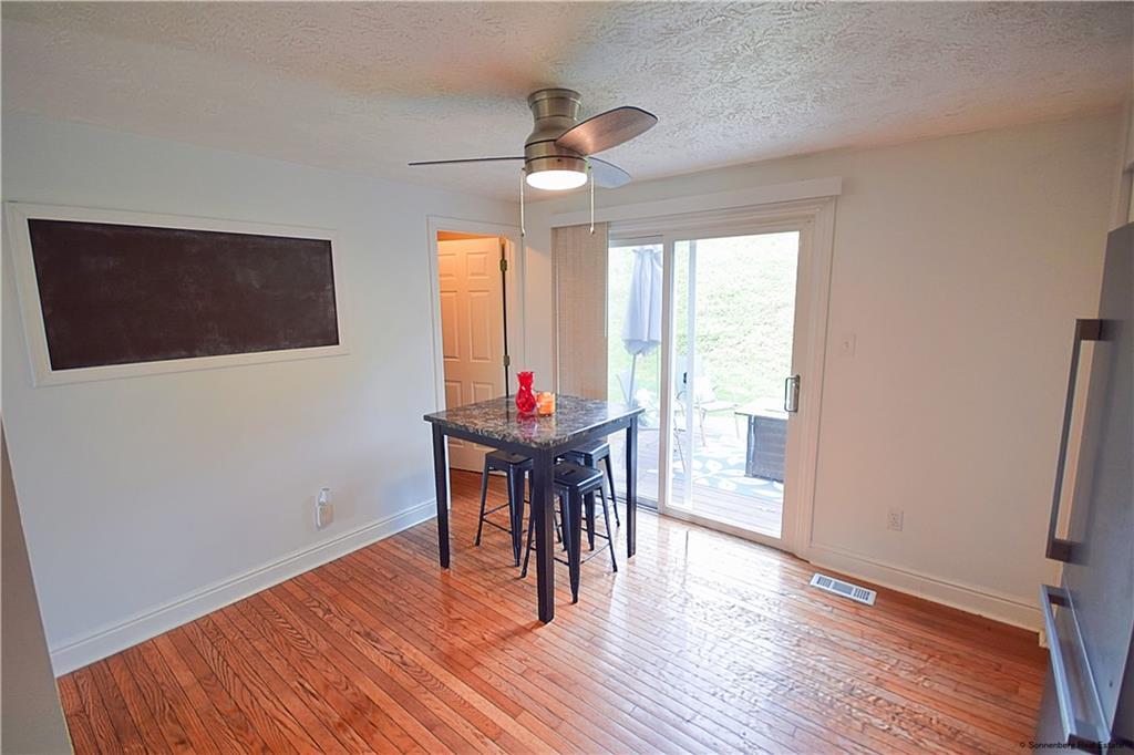 508 Countryside Drive McKees Rocks, PA 15136 - Photo 8 of 25 a view of a dining room with furniture window and wooden floor