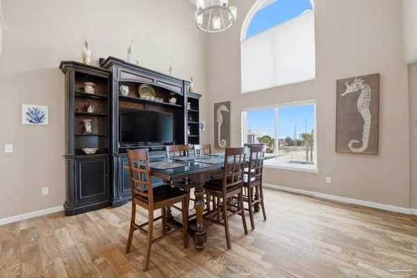 a view of a dining room with furniture and wooden floor
