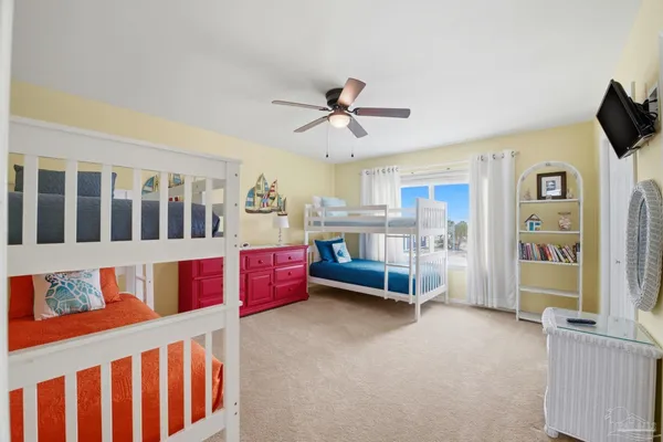 a bedroom with furniture and window