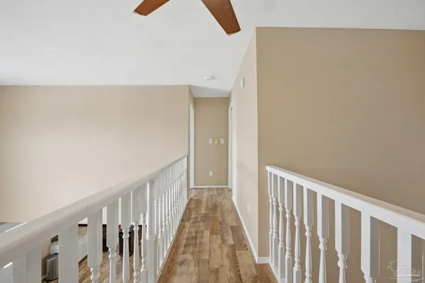 a bedroom with furniture and a large window
