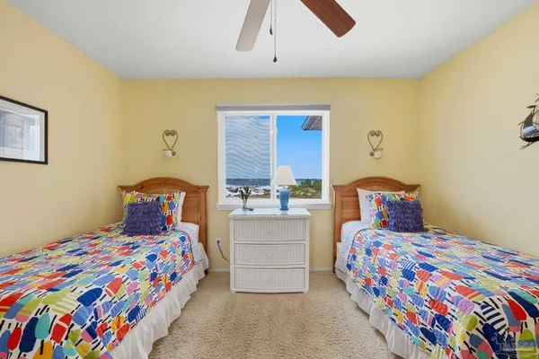 a bedroom with bed and window