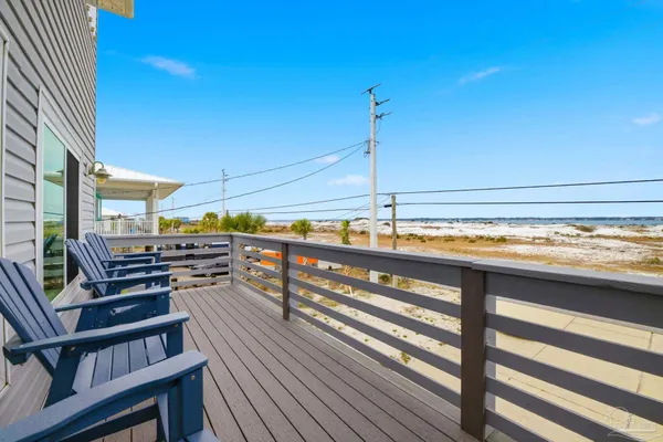 an aerial view of a house with a ocean view