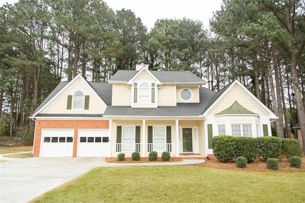 3078 Commons Crossing Snellville, GA 30078 - Photo 1 of 1 a front view of a residential houses with yard and green space