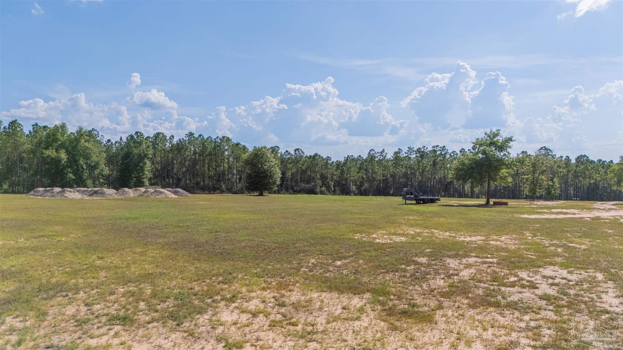 7047 Hidden Forest Trail Pace, FL 32571 - Photo 2 of 8 a view of a yard