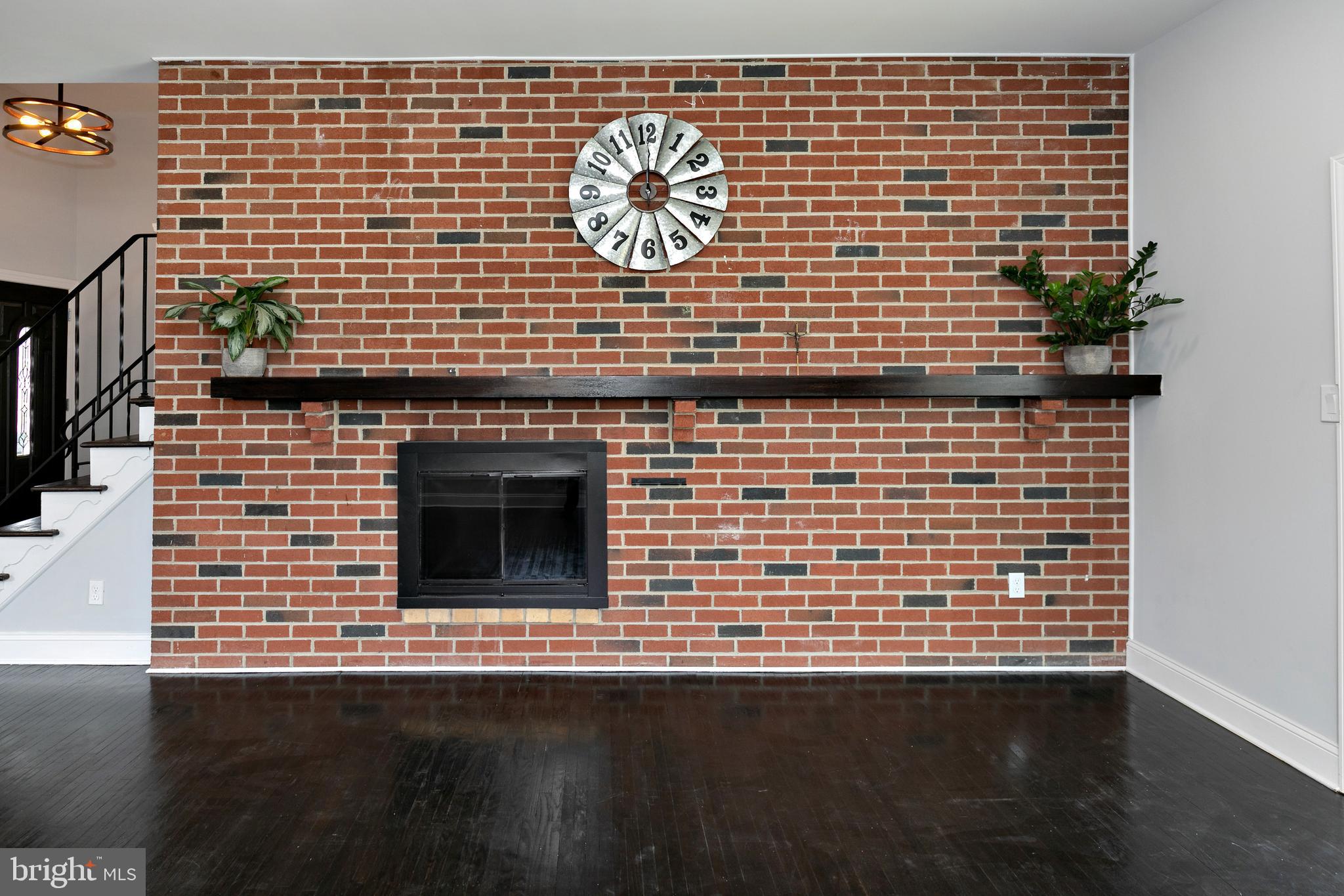 1109 York Road Cherry Hill, NJ 08034 - Photo 13 of 39 Brick feature wall with wood burning fire place