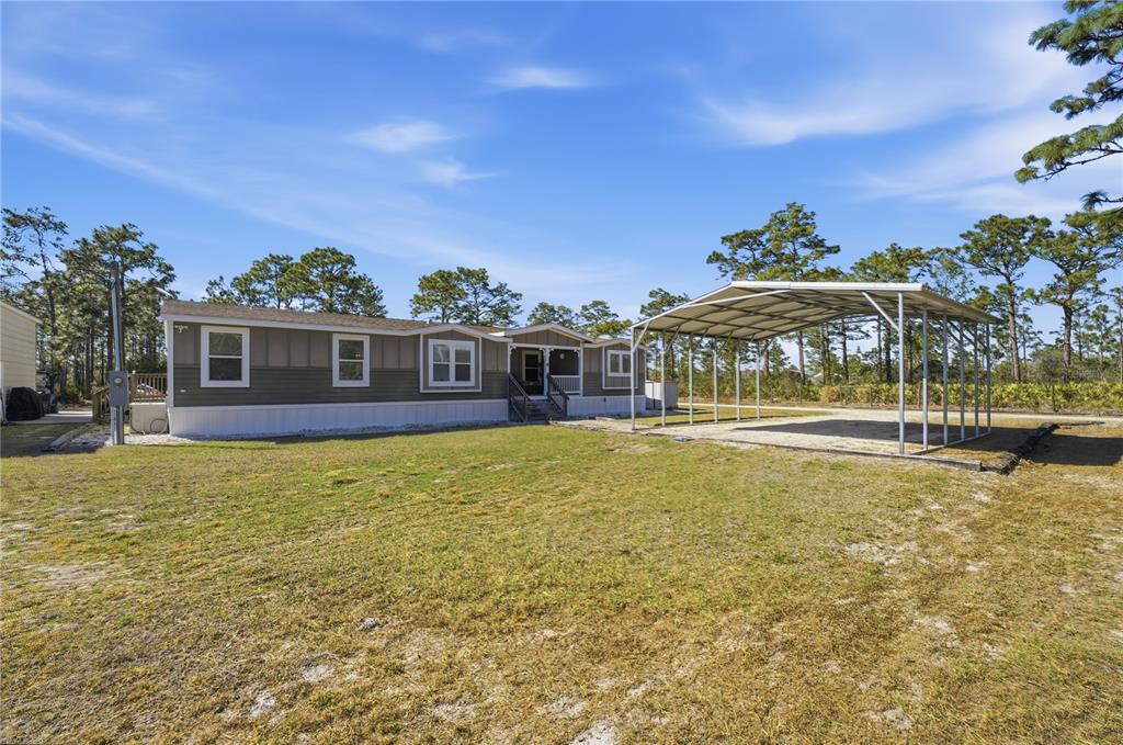 6844 Chad Jason Road St. Cloud, FL 34773 - Photo 2 of 59 a view of a house with a swimming pool