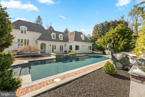 a living room with furniture a rug and a window