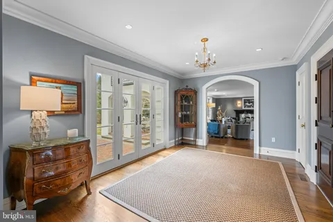 a bathroom with a granite countertop toilet a sink and a mirror