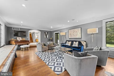 a view of a dining room with furniture wooden floor and chandelier
