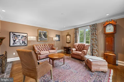 a kitchen with granite countertop wooden cabinets a sink and dishwasher a oven with wooden floors