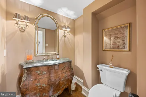a kitchen with stainless steel appliances granite countertop a stove and chairs
