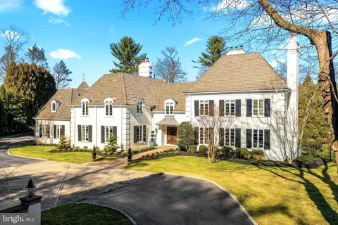 a view of a house with swimming pool and porch