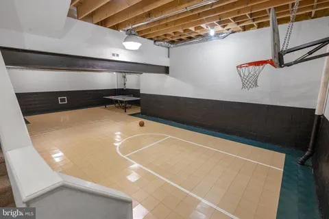 a view of a livingroom with workspace and a window