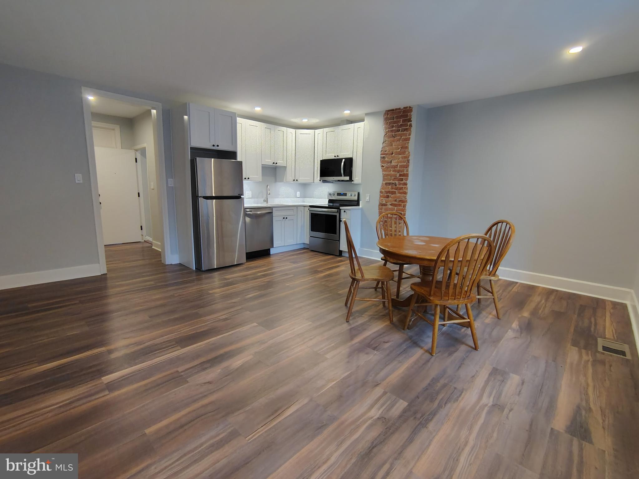 230 South Market Street, Unit 3 Frederick, MD 21701 - Photo 13 of 16 a living room with furniture and kitchen view