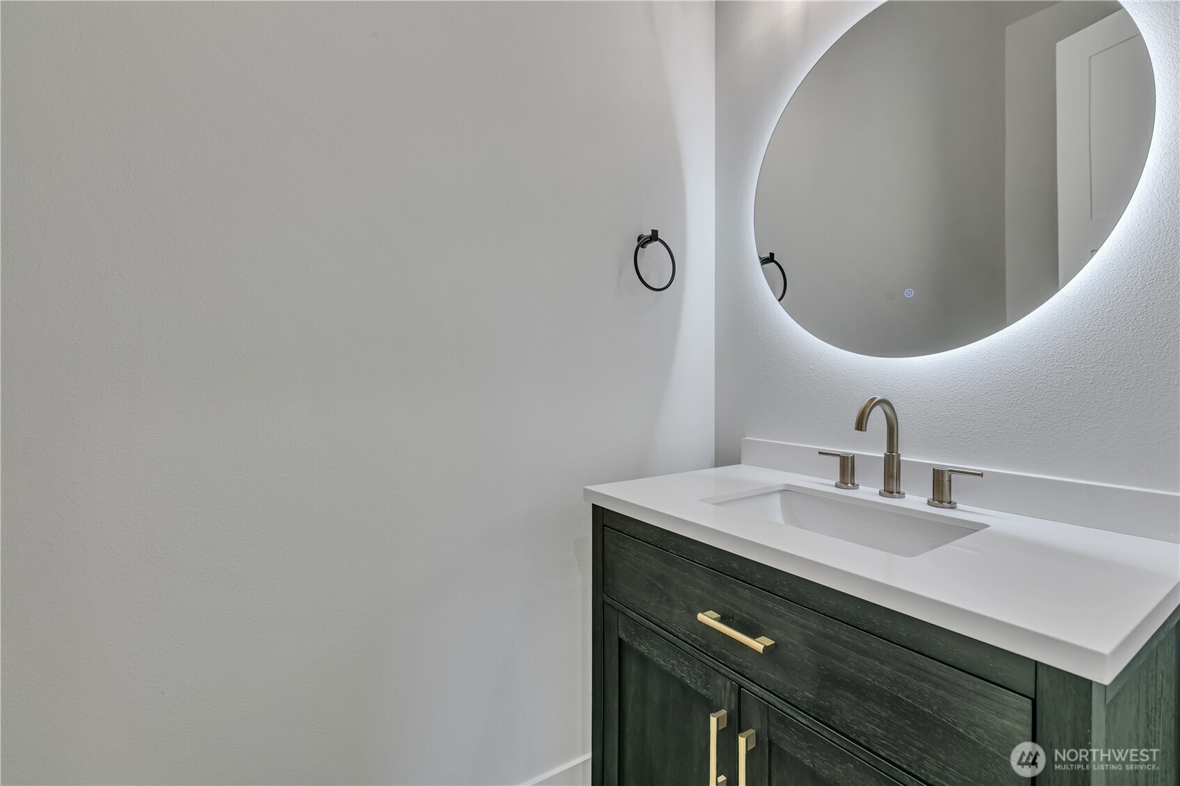 6709 254th Street East Graham, WA 98338 - Photo 26 of 40 a bathroom with a sink and a mirror