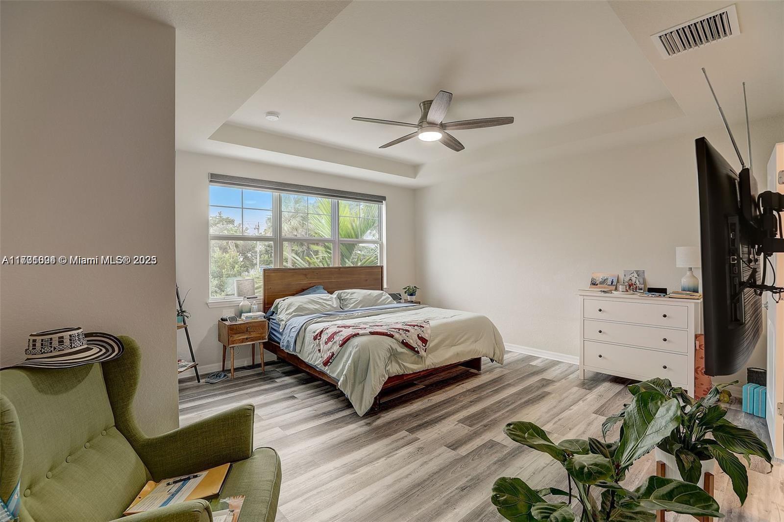 5182 Eucalyptus Drive, Unit 4 Hollywood, FL 33021 - Photo 11 of 22 a bedroom with a bed dresser and a window