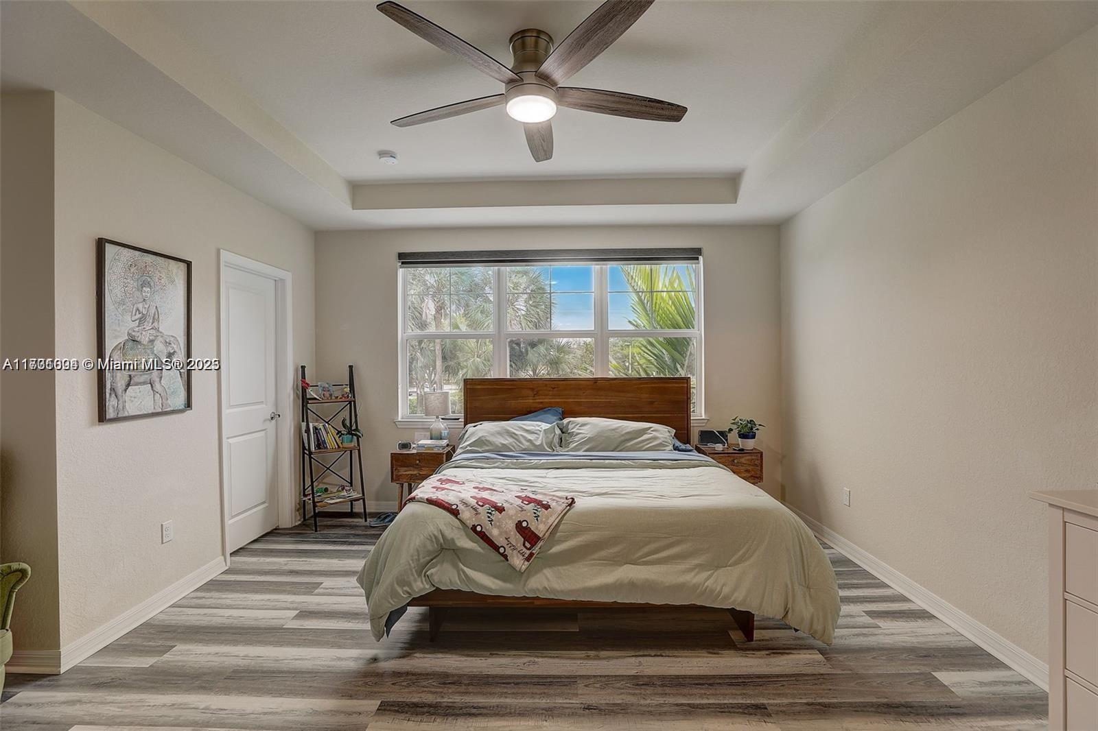 5182 Eucalyptus Drive, Unit 4 Hollywood, FL 33021 - Photo 12 of 22 a bedroom with a bed and a window