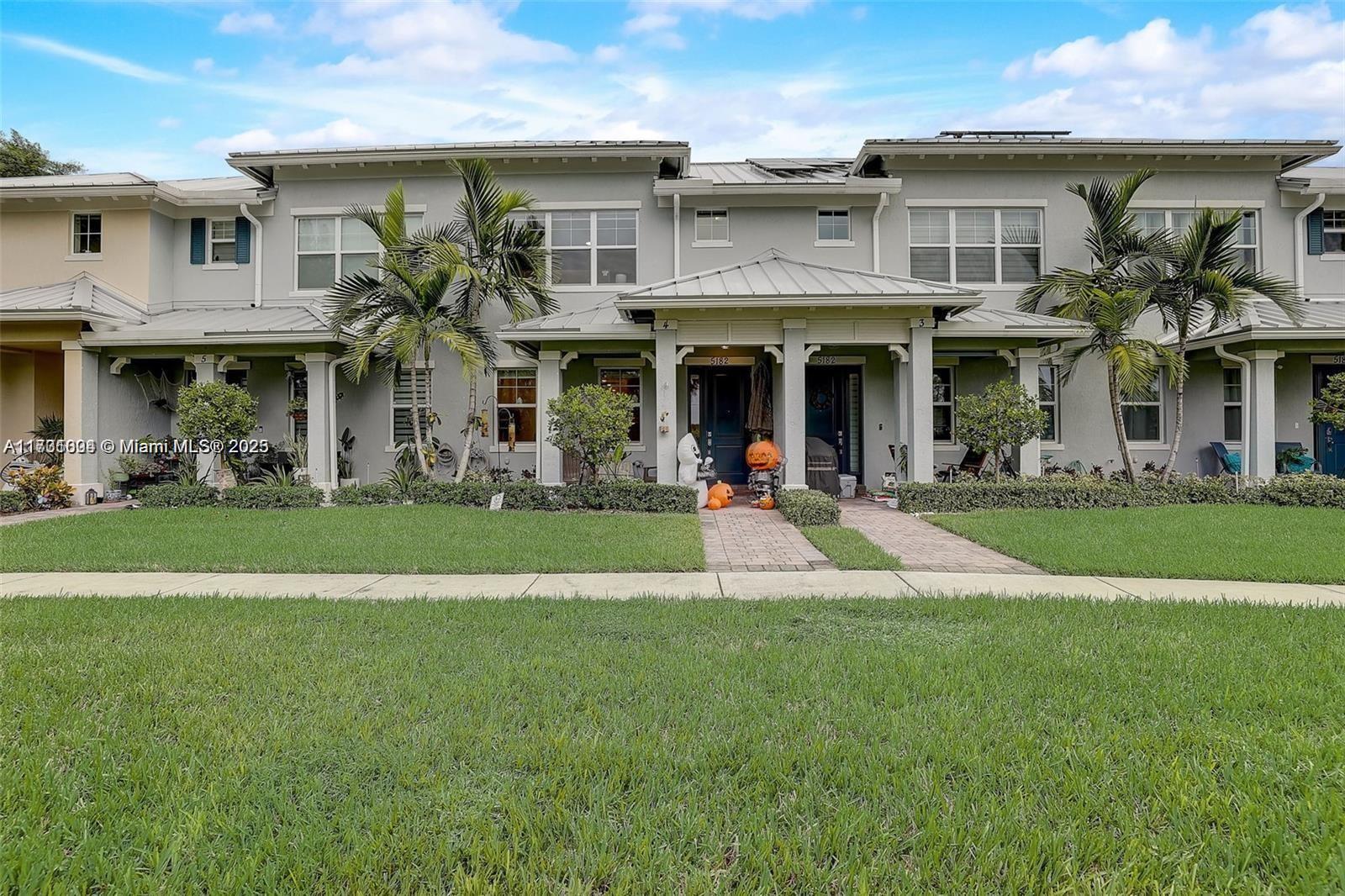5182 Eucalyptus Drive, Unit 4 Hollywood, FL 33021 - Photo 2 of 22 a view of a building with a swimming pool